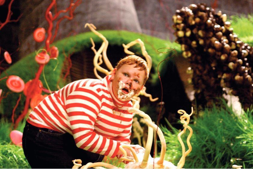 Charlie and the Chocolate Factory Picture 25. Movie medium shot of Phillip Wiegratz as Augustus eating in Chocolate Room.